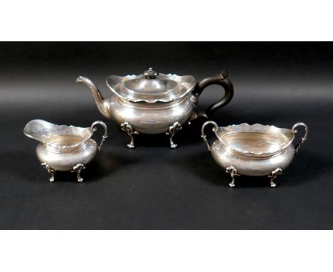 A Scottish silver three piece tea service, comprising teapot, 28.5 by 13 by 13cm high, 25.7toz, twin handle sugar bowl, 17 by