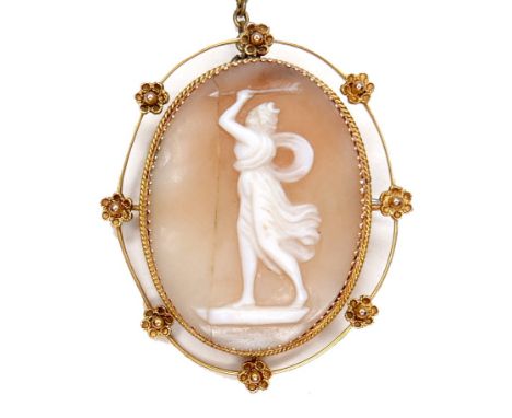 A Victorian 9ct gold oval shaped cameo brooch, carved with a classical lady brandishing an arrow above her head, within a flo