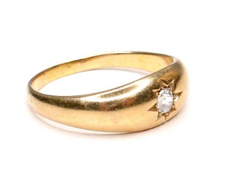 An 18ct gold and diamond gypsy ring, the old cut stone 3mm diameter, size T/U, 5.9g. 