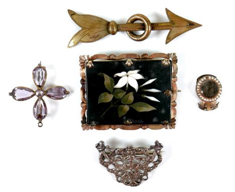 An early 20th century pietra dura brooch, depicting a white lily on a rectangular slate background, in an unmarked gold frame