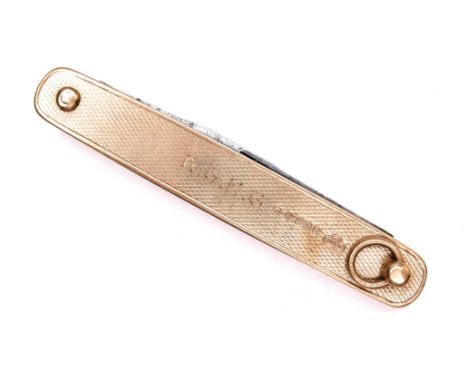A 9ct gold folding pocket knife, with twin blades, the sides with engine turned decoration, engraved initials ‘R. G. H. G.’, 