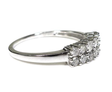 A 9ct white gold and diamond ring, set with two rows of brilliant cut diamonds, size N/O, 1.9g. 