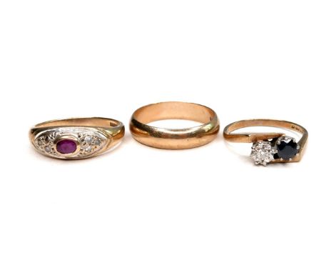 Three 9ct gold rings, comprising a diamond and sapphire crossover ring, round cut sapphire, 4.5mm diameter, illusion set roun