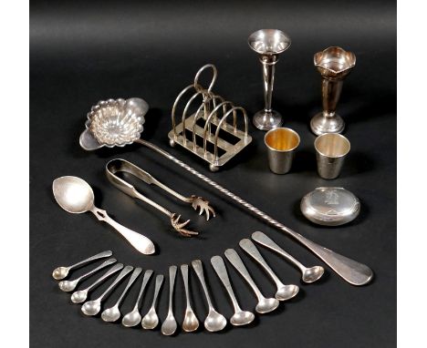 A group of silver items, comprising various small salt and mustard spoons, a small toast rack, Mappin & Webb, 10cm high, a Vi