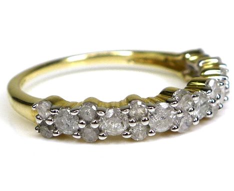 A 9ct gold and diamond half eternity ring, the brilliant cut stones of varying size set in a bubble design, size N/O, 1.7g. 