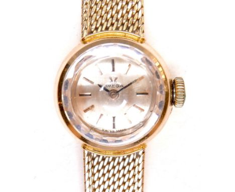 An Omega 18K gold cased lady's wristwatch, circa 1970s, model 542.645, the circular gold dial with gold and black index baton