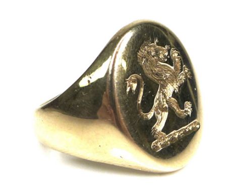 A 9ct gold signet ring, with rampant lion armorial, size O/P, 10.6g. 