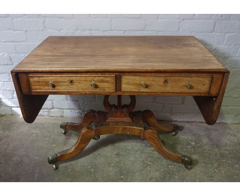 Regency Gillows style Mahogany Sofa Table, circa early 19th century, Having two small Drawers, Raised on a Platform base and 