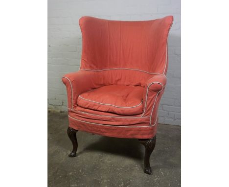 Antique Chippendale style Mahogany Armchair, Upholstered in later Fabric, Raised on Ball and Claw feet with Brass castors to 
