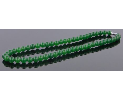 A modern string of Chinese green jade beads.
