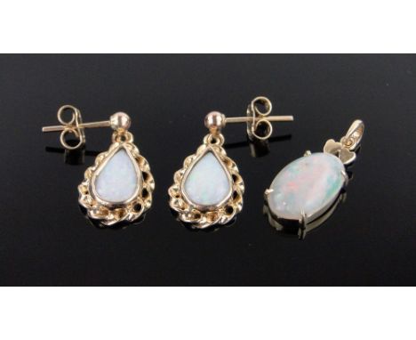 A pair of 9ct gold opal set drop earrings and an opal set gold pendant.