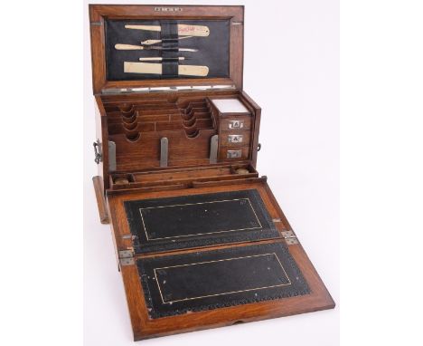 A Victorian light oak stationery cabinet,with fold-out writing slope enclosing fitted drawers, length 40cm.