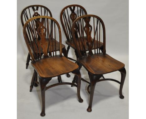 A set of 4 Windsor stick-back dining chairs,with crinoline stretchers.