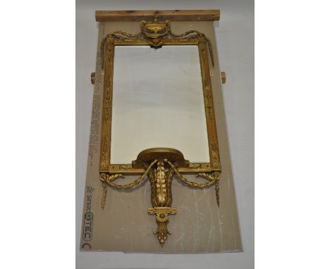 A 19th century giltwood and gesso pier glass mirror,with urn and swag applied pediment and shelf under, overall length 4'5", 