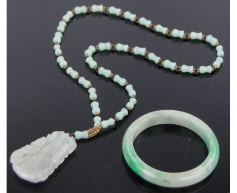 A Chinese relief carved green jade pendant on jade chain,and a Chinese jade bangle, (2).