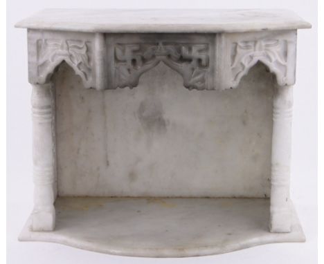 An Indian marble shelf bracket,with pierced sides and relief carved frieze, width 53cm, height 41cm.