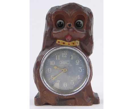A Second War Period carved wood cased dog shaped clock,made in occupied Japan 1945, height 15cm.