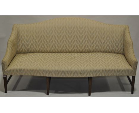 A George IV upholstered sofa raised on mahogany square tapered legs,length 6' 3",seat height 1' 5" settee height 3' 3"