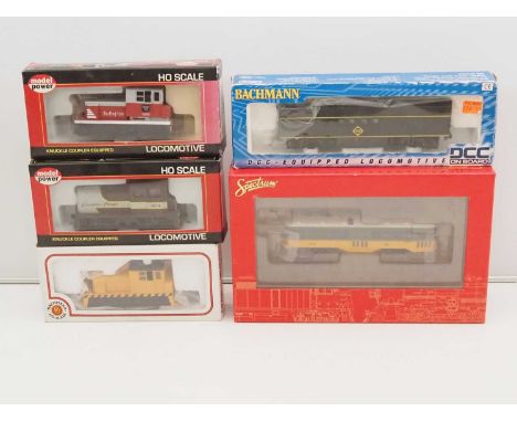 A group HO gauge American outline locomotives by BACHMANN and MODEL POWER together with a SPECTRUM 'Peter Witt' street car in