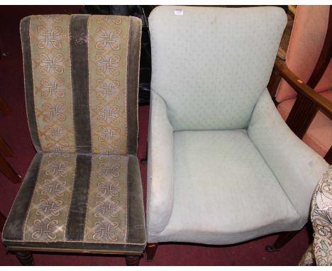 A circa 1900 blue floral upholstered armchair, raised on square tapering supports; together with a Victorian mahogany framed 