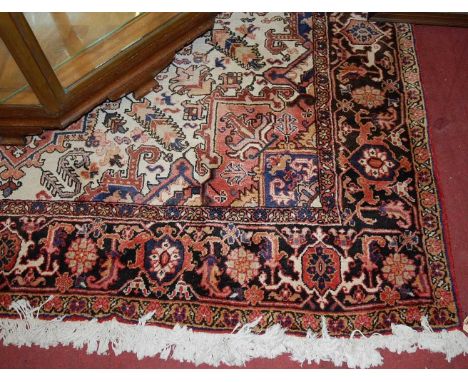 A large Persian woollen cream ground Tabriz rug, 360 x 250cmCondition report: Some fading and discolouration, mainly to one s