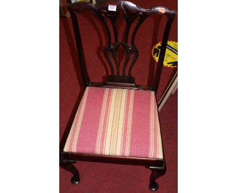 A set of four Edwardian stained walnut dining chairs, each having floral tapestry upholstered stuffover seats; together with 