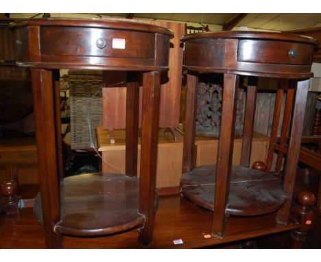 A pair of contemporary hardwood circular single drawer two-tier lamp tables, dia.50cm