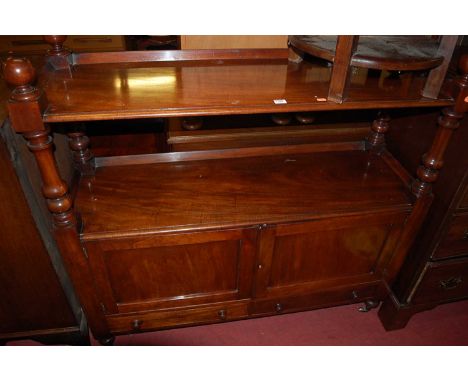 A Victorian mahogany buffet side cupboard, the ball shaped finials over turned columns to twin panelled cupboard doors over c