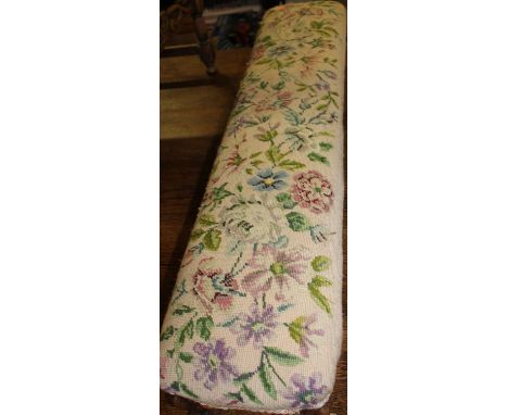 A Victorian rosewood framed and floral tapestry upholstered long footstool, length 110cm