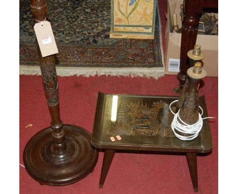 An Eastern carved camphor wood standard lamp; together with a matching low occasional table; and a pair of table lamps (4)