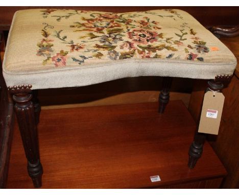A 19th century mahogany and floral tapestry upholstered dressing stool, raised on reeded turned and tapering supports (likely