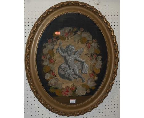 An early 20th century floral tapestry and beadwork embroidered oval wall panel, housed in a gilt frame, 61.5 x 51.5cm