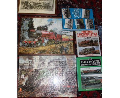 One box containing a small quantity of locomotive related books, two framed locomotive jigsaws, and a locomotive print