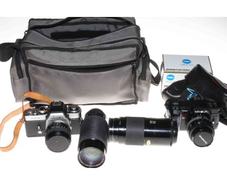 Two Minolta camera's, two lenses, program flash and camera bag.