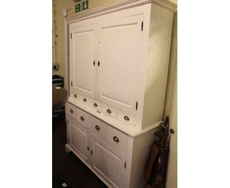 Continental white painted dresser, the top having two panelled doors above five small drawers, the base having four deep draw