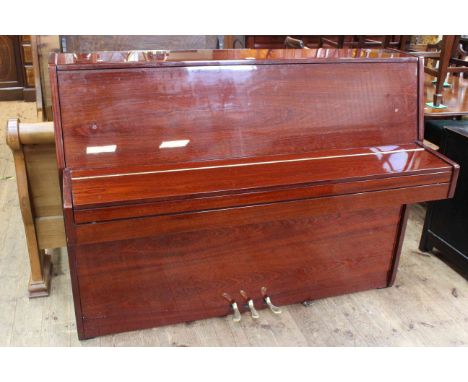 R. Schirmer lacquered rosewood upright overstrung piano, No. 570509148, 108cm high by 140cm wide by 57cm deep. (Very little u