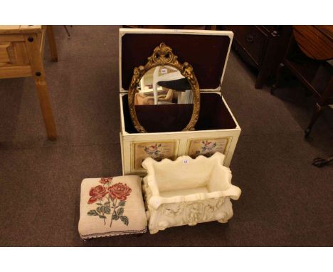 Floral decorated dome trunk, floral needlework footstool, oval gilt cherub wall mirror and composite planter (4).