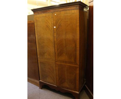 Early 20th Century mahogany and ebony line inlaid two door wardrobe on splayed bracket feet, 196cm high by 113cm wide by 56cm