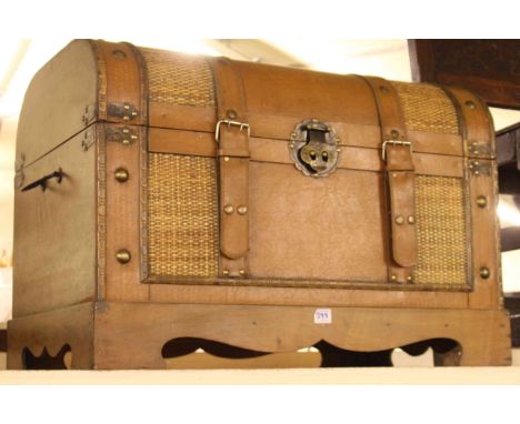Modern leather bound dome trunk.