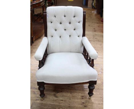 Victorian turned leg armchair in light buttoned fabric. (Slight split to frame and marks to frame).