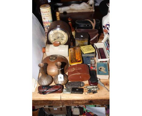 Oak mantel clock, two pairs of binoculars, bottle of Glenmorange, pair of copper vases, copper water bottle, stone water bott