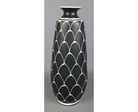 A Larholm Norwegian pottery vase decorated with white on black scale pattern. Signed to base and numbered 109. Approx. height