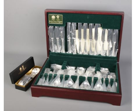 Arthur Price of England silver plated canteen of cutlery in mahogany box with a boxed ladle spoon, all unused.  Canteen box s
