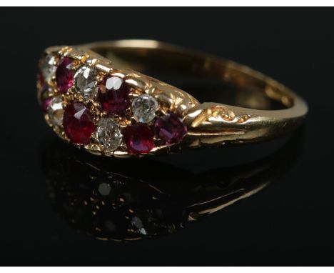 An 18ct gold ruby and diamond ring. Size N. 3.29g.  Wear to shank and setting.