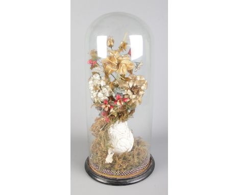 A Victorian flower display in glass dome featuring ceramic vase containing bouquet of Ganutell wirework flowers and cascade o