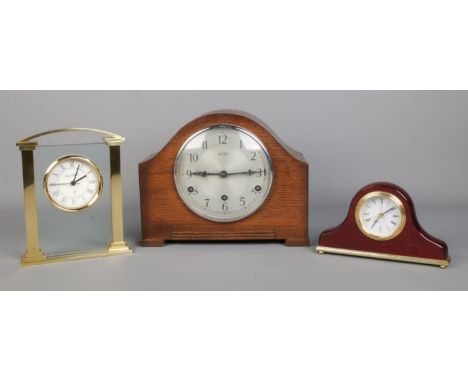 A Bentima mantle clock with Perivale movement, together with two later quartz examples; one by the London Clock Co.  Key miss