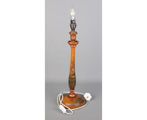 An vintage Chinoiserie table lamp, light wood body and decorated with oriental scenes and figures.  Working, in good conditio