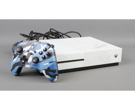 An XBox One S, in white (Model 1681) with power lead and blue Power A controller.  Controller does not work with headset.