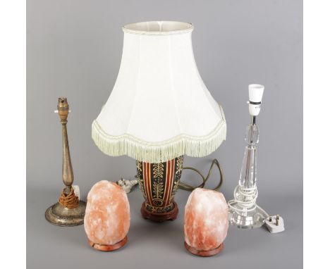 A collection of assorted table lamps, featuring ceramic, metal, glass designs, along with two Himalayan salt lamps.  Metal an