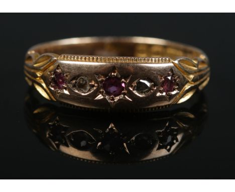 A late Victorian 15ct gold ruby and diamond gypsy set ring. Size P 1/2. 2.81g.